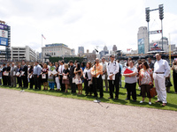 Official swearing in of 60 new American citizens administered by Judge Denise Page Hood during  pregame ceremonies of  a baseball game betwe...