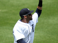 Detroit Tigers' J.D. Martinez catches the ball hit by Pittsburgh Pirates Starling Marte in the first inning of a baseball game in Detroit, M...