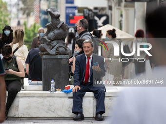 A man seen sitted at Ermou street in the center of Athens, Greece on May 7, 2021. (