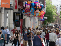 A man seen holding balloons at Ermou street in the center of Athens, Greece on May 7, 2021. (