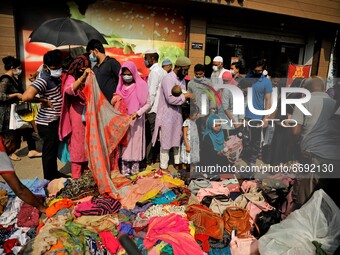People gather at Dhaka New market for shopping ahead Eid-ul-fitr as they are not maintaining any kind of social distancing in Dhaka, Banglad...