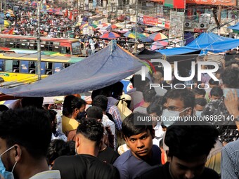 People gather at Dhaka New market for shopping ahead Eid-ul-fitr as they are not maintaining any kind of social distancing in Dhaka, Banglad...