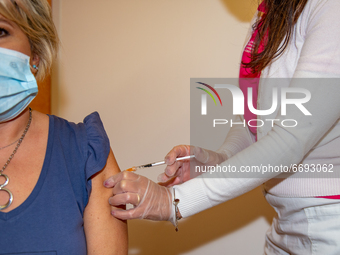 Nurse administers the AstraZeneca vaccine to a woman in Rieti, Italy, on May 8, 2021 in the new Vaccine Hub at the Vierdirosi Barracks  duri...
