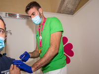 Nurse administers the AstraZeneca vaccine to a man in Rieti, Italy, on May 8, 2021 in the new Vaccine Hub at the Vierdirosi Barracks  during...