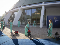 Ladies cleaning the blue carpet for the arrival of the heads of state and government and leaders of the European institutions, at the Crysta...