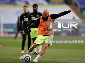 Jonjo Shelvey of Newcastle United shoots as he warms up ahead of the Premier League match between Leicester City and Newcastle United at the...