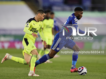 Kelechi Iheanacho of Leicester City runs with the ball followed by Miguel Almiron of Newcastle United during the Premier League match betwee...