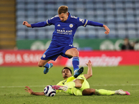 Marc Albrighton of Leicester City jumps to avoid a tackle from Jacob Murphy of Newcastle United during the Premier League match between Leic...