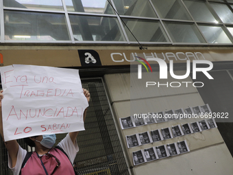 A woman demonstrates outside the Culhuacán subway station where photographs of the 25 people who died after the collapse of Metro line 12 on...