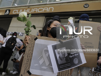 Demonstrators outside the Culhuacán subway station where photographs of the 25 people who died after the collapse of Metro line 12 on the ni...