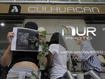 Demonstrators outside the Culhuacán subway station where photographs of the 25 people who died after the collapse of Metro line 12 on the ni...