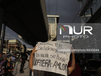 Demonstrators on Avenida Tláhuac after the collapse of Metro line 12 on the night of May 3 between Tezonco and Olivos stations in Mexico Cit...
