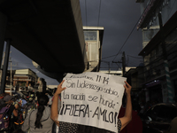 Demonstrators on Avenida Tláhuac after the collapse of Metro line 12 on the night of May 3 between Tezonco and Olivos stations in Mexico Cit...