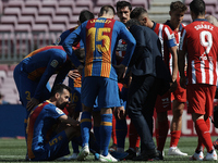 Sergio Busquets of Barcelona lies injured on the pitch during the La Liga Santander match between FC Barcelona and Atletico de Madrid at Cam...