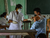 Youth takes vaccine against COVID-19 coronavirus, at a vaccination centre, in Guwahati, India on Saturday, 08 May 2021.  Government announce...