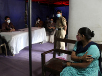 A woman waits in an observation area after getting a dose of COVAXIN, a coronavirus (COVID-19) vaccine manufactured by Bharat Biotech, at a...