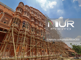 Labourers carry out the restoration work of historical Hawa Mahal in Jaipur,Rajasthan, India, Saturday, May 8, 2021.(