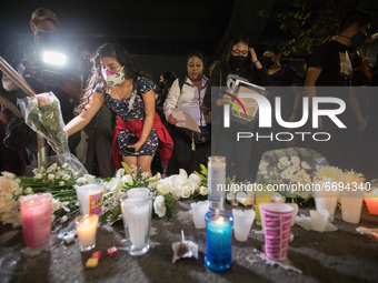 Persons deposit candles and white flowers in crash site  in  memory of the victims that lost their lives due the Mexico City metro overpass...