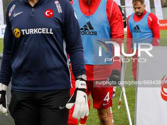 Muhittin Kurt (middle) leaves the pitch as Turkey wins over Poland in a friendly match ofEuropean Amputee Football Federation held in Pradni...