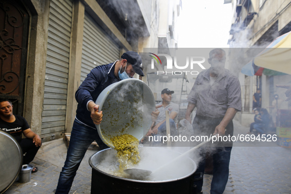 A palestinian man Waleed AL-Hataab cooking the soup everyday of a Ramadan fasting day in east of Gaza City, for free during the Muslim fasti...