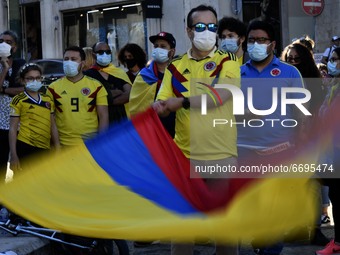 A protester waves a Colombian flag during a rally in Luis de Camões square, Lisbon. 08 May 2021. Colombians in Portugal held a sit-in to sho...