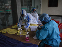 Health workers prepare prescriptions at a temporary Covid-19 hospital in Srinagar, Indian Administered Kashmir on 08 May 2021. A Local NGO A...