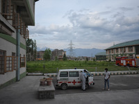 Volunteers prepare an ambulance to shift a covid-19 patient outside a temporary hospital in Srinagar, Indian Administered Kashmir on 08 May...