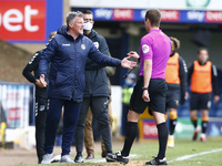 L-R  Wayne Hatswell Assistant Manager of Newport County have words with Referee J. Brooks during Sky Bet League Two between Southend United...