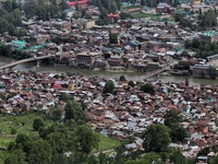 Aerial view of Baramulla town as security vehicle is seen on a bridge to stop the movement of people during COVID-19 Corona Curfew in Baramu...