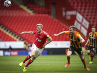   Jaydn Stockley of Charlton Athletic is watched by Callum Elder of Hull City for the ball during the Sky Bet League 1 match between Charlto...