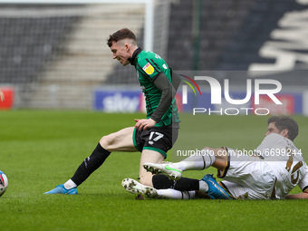  Rochdale's Conor Grant is bought down by Milton Keynes Dons Andrew Surman during the first half of the Sky Bet League One match between MK...