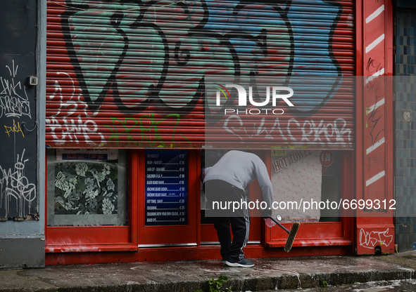 A man cleans the facade of a local barbershop in Dublin's Portobello area before it reopens, scheduled for tomorrow 10 May.
On Sunday, 9 May...