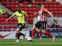  Michael Harriman of Northampton Town in action with Sunderland's  Charlie Wyke during the Sky Bet League 1 match between Sunderland and Nor...