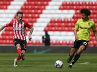  Josh Scowen of Sunderland and Shaun McWilliams of Northampton Town  during the Sky Bet League 1 match between Sunderland and Northampton To...