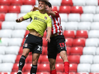   Danny Rose of Northampton Town contests a header with Luke O'Nien of Sunderland during the Sky Bet League 1 match between Sunderland and N...