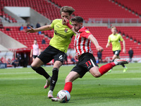   Lynden Gooch of Sunderland in action with Fraser Horsfall of Northampton Town during the Sky Bet League 1 match between Sunderland and Nor...
