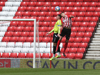  Lloyd Jones of Northampton Town contests a header with Sunderland's  Charlie Wyke during the Sky Bet League 1 match between Sunderland and...