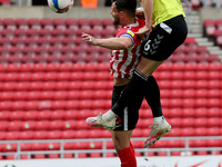  Fraser Horsfall of Northampton Town contests a header with Sunderland's  Bailey Wright  during the Sky Bet League 1 match between Sunderlan...