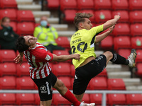  Danny Rose of Northampton Town contests a header with Sunderland's  Luke O'Nien during the Sky Bet League 1 match between Sunderland and No...