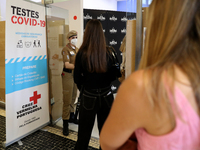 Spectators queue in line for a COVID-19 coronavirus test prior to a comedy pilot test event at Campo Pequeno in Lisbon, Portugal, on May 9,...