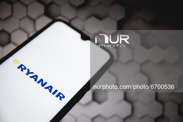 In this photo illustration a Ryanair logo seen displayed on a smartphone screen with a computer wallpaper in the background in Athens, Greec...