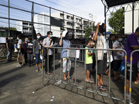 Thai People from the residential community queue up during a proactive mass nasal swab test to contain the rapid spreading of the COVID-19 p...