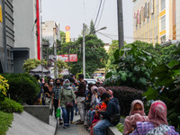 People shop at a market ahead of the Eid al-Fitr celebrations during the Muslim holy month of Ramadan amid the COVID-19 pandemic on 10, May...