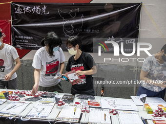 Supporters stand at a booth for the June 4 Vigil in Hong Kong, Sunday, May 9, 2021. The Hong Kong Alliance in Support of Patriotic Democrati...