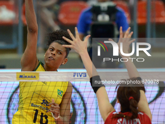 Fernanda Rodrigues (L) of Brazil spikes the ball during the FIVB World Grand Prix intercontinental round match against Japanl at Indoor Stad...