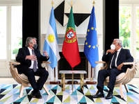 Portuguese Prime Minister Antonio Costa (R ) and Argentina's President Alberto Fernandez chat during their meeting at the Sao Bento Palace i...