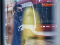 A man wearing a protective face mask waits at a bus stop in Downtown Toronto in Toronto, Canada on May 10, 2021. Ontario reported 2,716 new...