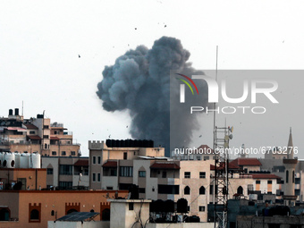Smoke rises after an Israeli forces strike in Gaza in Gaza City, Tuesday, May 11, 2021. (
