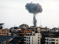 Smoke rises after an Israeli forces strike in Gaza in Gaza City, Tuesday, May 11, 2021. (