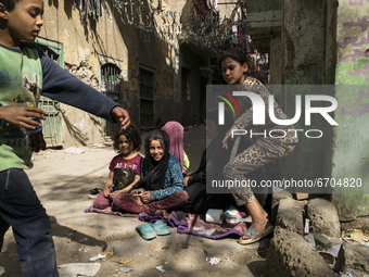 Children in the streets of Shoubra , a local area of Cairo are playing  while waiting for the first meal of the day in Ramadan on April 13,...